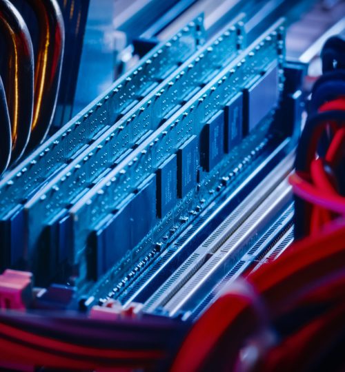 Close-up Macro Shot of Installed RAM Memory in Computer Motherboard Slot. Technically Advanced PC / Server System. Modern High-End PC Shot in Stylish Neon, Pink-Blue Colors.